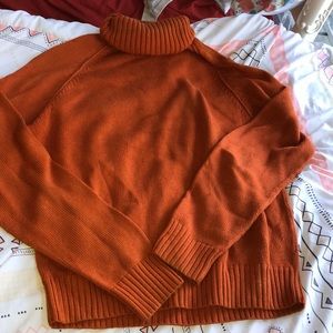 Orange turtleneck sweater